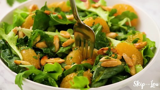 Mandarin Orange Salad with sugared almonds is the perfect sweet and savory side dish! Versatile enough to accompany stir fry or pork tenderloin, this mandarin orange recipe will quickly become your go to salad recipe. | The Best Blog Recipes