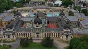 One of the largest spa complexes of the Szechenyi Thermal Bath in the Budapest City Park. In the background is the capital's Great Circus, as well as the capital's Zoo. Budapest, Hungary / 06.11.2020.
