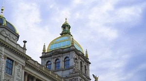 Prague's mesmerizing architecture with a golden top roof tower and aqua blue colour windows iconic building in the heart of the city where most tourists go to admire this creation based on bible