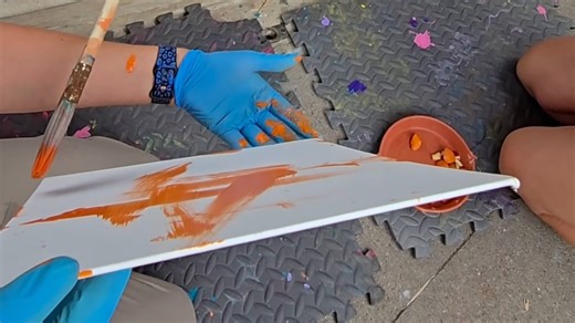 For those of you who weren’t able to attend the orangutan painting demonstrations today, we are thrilled to let you know that animal care volunteer/docent Barb was able to film this afternoon’s enriching activity! Forty-nine-year-old orangutan Jill, who you’ll often see painting on her own in the indoor habitat, also participates in art sessions with her care team. She will maneuver a paintbrush and receives her favorite treats during the process. These paintings can be found in the Deja Zoo gif