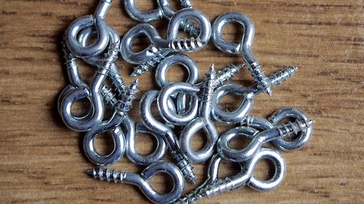 When To Use Eye Screws For Hanging Picture Frames - House Digest