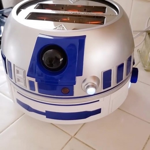 Williams Sonoma on Instagram: "Yes, it makes sounds. Our #R2D2 Toaster 🍞 is the ultimate gift for Star Wars™ fans. Insert bread, press the lever, and Artoo’s lights up and chirps while toasting. Like toast on the dark side? Use the dial to adjust browning. Shop all #StarWars gifts with the link in bio. 🎥: @rollinwthestones #starwarslife"