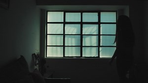 Silhouette of woman opening a window - Free Stock Video