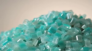 A closeup of a large mound of recycled plastic pellets ready to be repurposed..