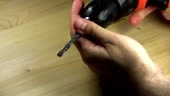 Changing a drill bit using the drill itself to loosen and tighten.