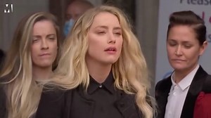 Amber Heard heckled by Depp fans during statement outside court