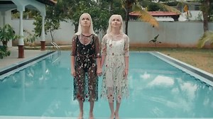 Girl two friends jump to swimming pool in clothes dress party hotel model drop in water, underwater twins happy fun hands
