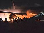 Terrified passengers flee past flaming engine before it explodes
