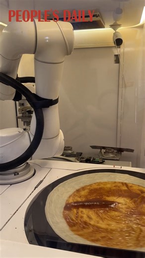 Give it a few minutes and get a Jian Bing, or the Chinese crepe, fresh from this robot cook real quick! | People's Daily, China