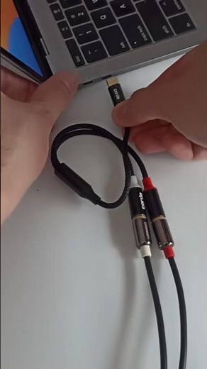 Plug USB-C audio DAC adapter with Stereo RCA cable attached into type C port Apple MacBook #shorts