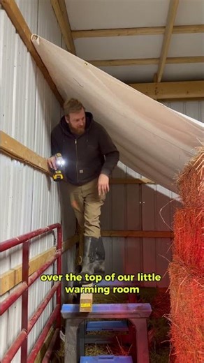 installing tarp in barn