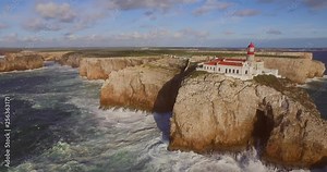 Big waves at the most south western point of Europe, Cabo de São Vicente and Sagres in the Algarve, Portugal. Aerial shot.