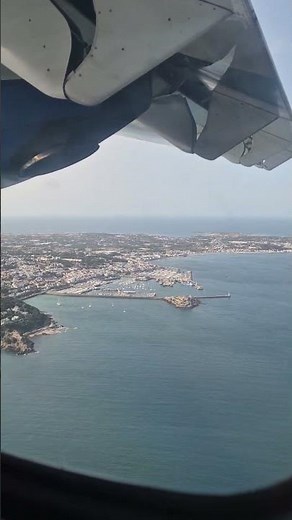Landing at Guernsey Airport flying over St Peter Port with Blue islands