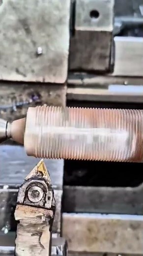 repairing damaged spark plug threads using a lathe