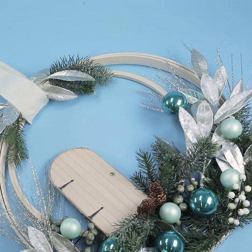 We found your next weekend holiday project! Make this beautiful DIY Fairy Door Wreath: http://wmdy.us/DFqYXw9 | Woman's Day Magazine