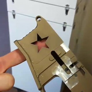 Laser cutting of an AR15 lower receiver Mag well cut through on the QM50PLUS high power laser engraving and cutting system from Z-Tech Advanced Technologies Inc. | Z-Tech Advanced Technologies Inc.