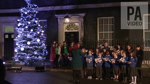 9.8K views · 52 reactions | Theresa May turns on the Downing Street Christmas tree lights with the Prime Minister Christmas Card Competition winners. | PA Media | Facebook