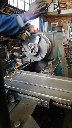 SIMPLY EASILY MOUNTING FOUR JAWS CHUCK ON UNIVERSAL LATH IN MANUFACTURING WORKSHOP