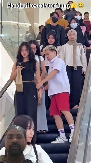 Handcuff escalator funny 🫣😂 #handcuff #new #shorts #trending #viral #youtubeshorts #comedy