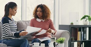 Paperwork, office talk and business people in a meeting with planning notes for a project. Collaboration, teamwork and women working on a creative web design plan with management and communication