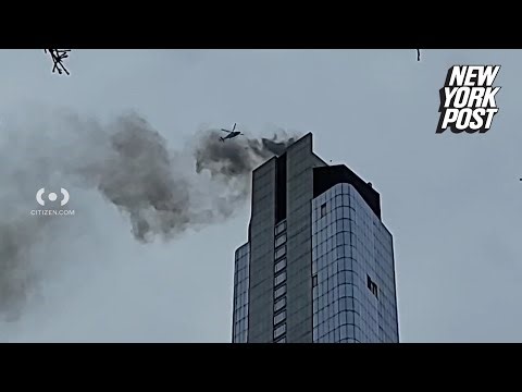 Thick smoke, flames burst out of skyscraper near World Trade Center after rooftop fire