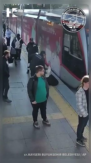 Close call as woman steps into tram lane with headphones on