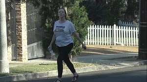 Recently separated Christina Hendricks looks glum walking her dog
