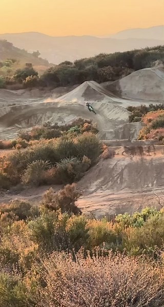 Motocross Rider Excels on Rugged Dirt Track
