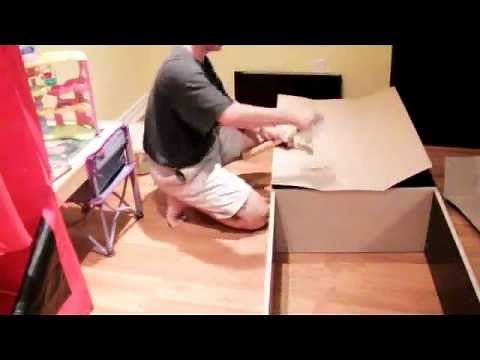 How to build a home library in your basement using bookshelves and thousands of books