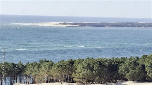 View from Dune du Pilat over the entrance of Arcachon Bay with the tip of Cap Ferret in the distance in southwest France.
