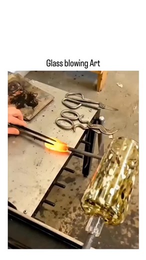factogi on Instagram: "The video showcases a mesmerizing glassblowing demonstration in a studio setting, where artisans gather molten glass at over 1,400°C, shape it on blowpipes using tools like jacks and shears, and create vibrant, swirling-patterned vases and platters through techniques like free-blowing and color layering. Posted by @interesting_aIl , an account focused on captivating art and history content, the clip has quickly garnered 166,000 views and 600+ likes within hours, with repli