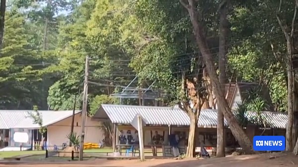 Residents in Thailand's Surin province run for cover from gunfire