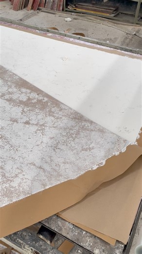 Quartz slabs are created by mixing natural quartz crystals with resin and pigments. The mixture is spread into molds, then vacuum-pressed to remove air bubbles. After curing in an oven, the slabs are cooled, trimmed, and polished to perfection. The result is a durable, beautiful surface with unique patterns. #QuartzSlabs #QuartzStone #CalacattaQuartz #StoneManufacturing #SurfaceDesign #Craftsmanship #LuxuryInteriors | Sodo Industries