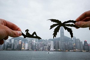 Artist uses paper cut-outs to create surreal scenes with Hong Kong landmarks