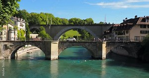 Bern, Switzerland - July 12, 2022: Historical old town of Bern with two bridges over the Aare river in summer