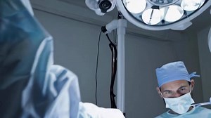 Download Surgical Procedure Footage in Modern Operating Room with Medical Team for free