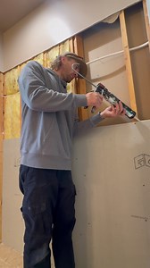 Waterproofing the shower walls using GoBoard. Used backer board screws with a bigger head instead of washers. Doesn’t get much easier than this. #bathroomrenovation #showerremodel #diy | KLK Builds