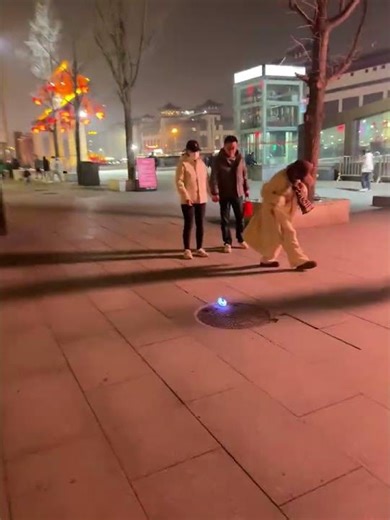 Light-up ball rolls across public plaza, Shaanxi, China