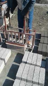 Hand held maxi brick machine