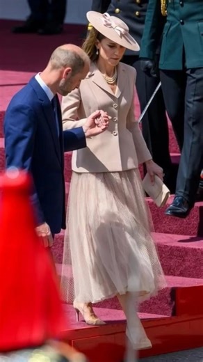 Princess Kate Middleton looking Beautiful wearing Pink skirt and a beautiful hat .