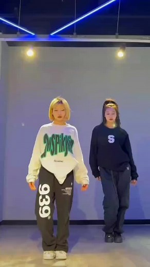Dynamic Dance Routine in Neon-lit Studio
