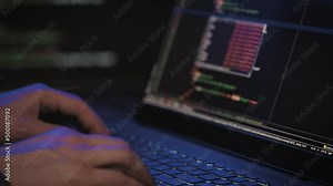Programmer's hands and laptop keyboard close-up. Working on a project on a laptop.