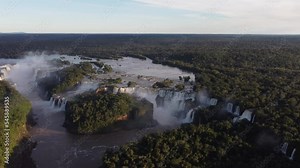 stunning aerial views of the Iguazu Falls and Amazon rainforest at sunset. circular drone