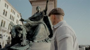 Man Observes The Historic Saint Mark s Lion Statue In Venice