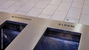 Motion of people throwing trash to the garbage can inside shopping mall with 4k resolution. Stock Video