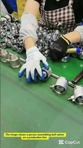 Worker Assembling Ball Valves in a Manufacturing Setting