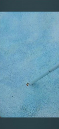 The best way to remove a rust stain from the bottom of a swimming pool.
