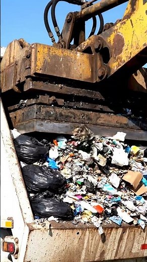 Garbage Truck Crushing Trash