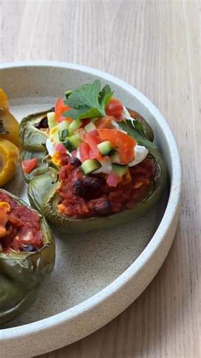 VEGETARIAN STUFFED CAPSICUMS The easiest, low maintenance dinner you need to try out this week Ingredients: 3 large capsicums (any colour, halved lengthwise, seeds removed) 1 tbsp olive oil 1 small onion, finely diced 2 garlic cloves, minced 1 tsp ground cumin 1 tsp smoked paprika 1 can (400 g) black beans, drained and rinsed 1 cup cooked rice or quinoa (about ½ cup uncooked) 1 cup corn kernels (fresh, frozen, or canned) 400g canned diced tomatoes 40g grated cheese Salt and pepper, to taste Fres