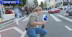 9 News reporter shot at with rubber bullet live on air